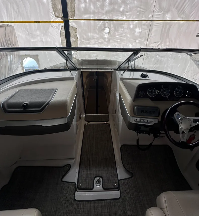 Slide: The Image of 2012 Regal 2700 Bowrider interior with steering wheel and dashboard controls. - 16