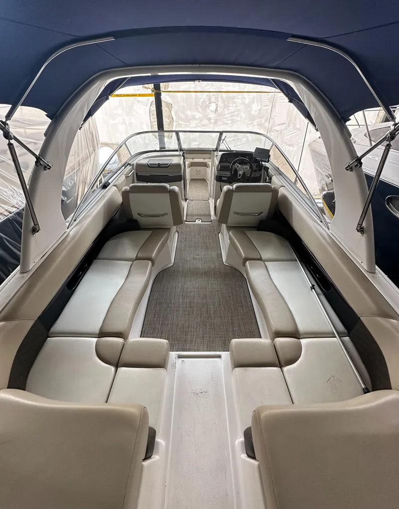 Slide: The Image of 2012 Regal 2700 Bowrider interior with spacious seating and sleek design. - 6
