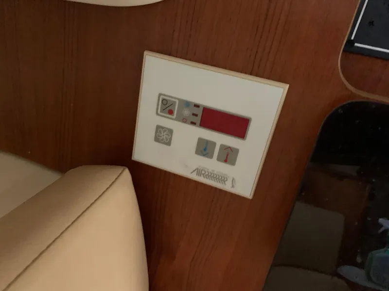 Slide: The Image of Control panel on 2007 Pursuit OS 335 boat, featuring various buttons and indicators. - 19