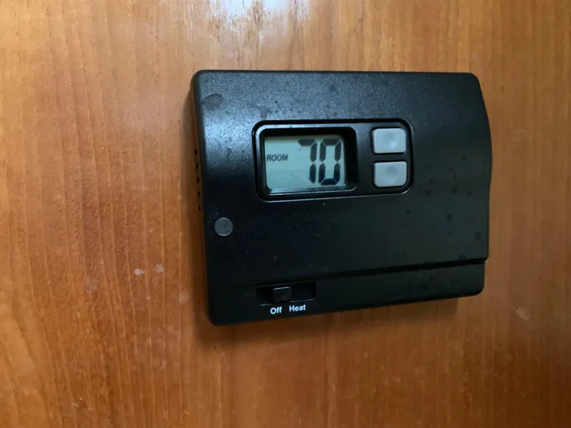Slide: The Image of Digital thermostat on wooden panel in a 2007 Pursuit OS 335 boat. - 20
