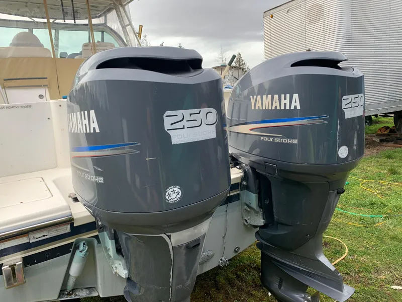 Slide: The Image of Twin Yamaha 250 outboard motors on a 2007 Pursuit OS 335 boat. - 5