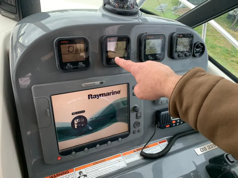Slide: The Image of Control panel of a 2007 Pursuit OS 335 boat with Raymarine navigation system. - 9