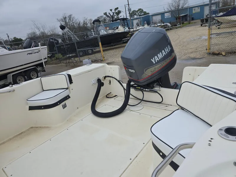 Slide: The Image of 2003 Scout 202 Dorado boat with Yamaha outboard motor in a boatyard. - 5