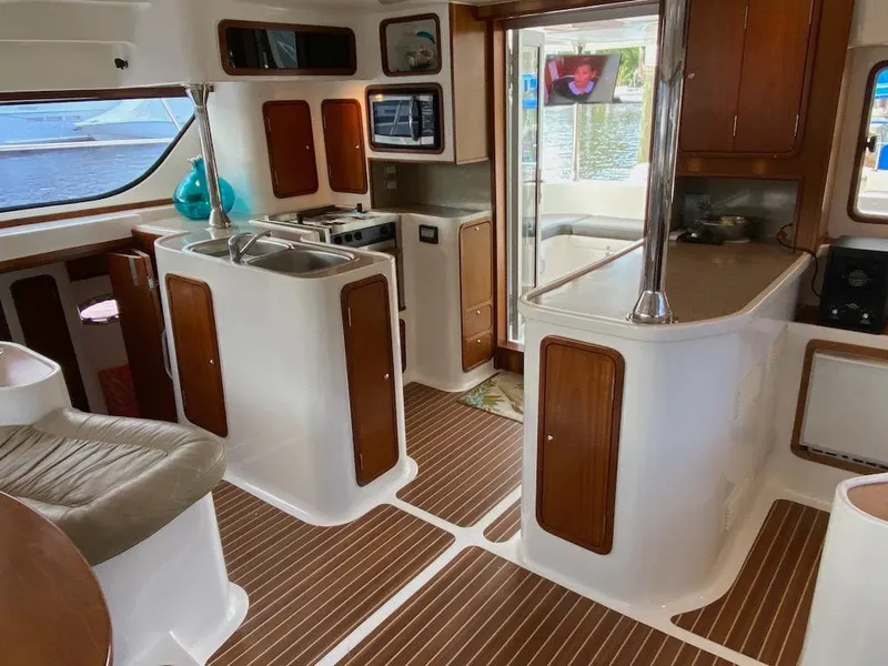 Slide: The Image of Interior of 2013 Africat Marine AfriCat PowerCat Sportfisher with modern kitchen and seating area. - 10