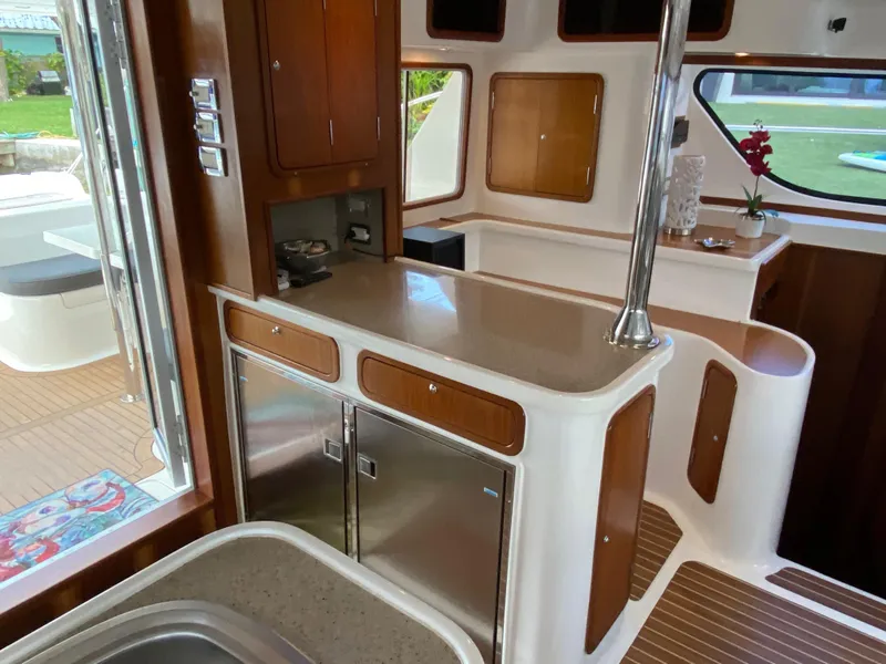 Slide: The Image of Interior of 2013 Africat Marine AfriCat PowerCat Sportfisher with modern kitchen amenities. - 14