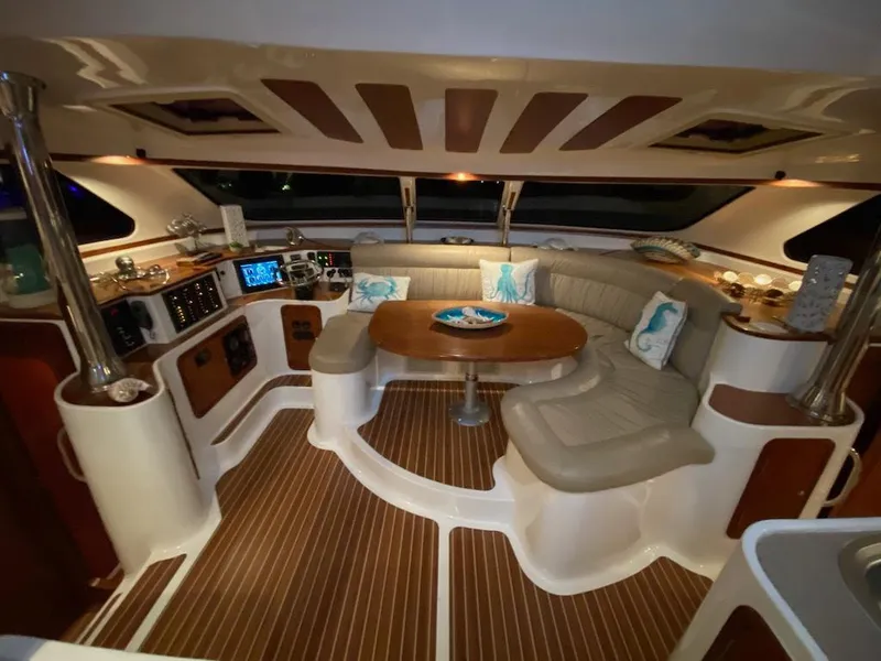 Slide: The Image of Luxurious interior of 2013 Africat Marine AfriCat PowerCat Sportfisher with elegant seating and wood accents. - 18