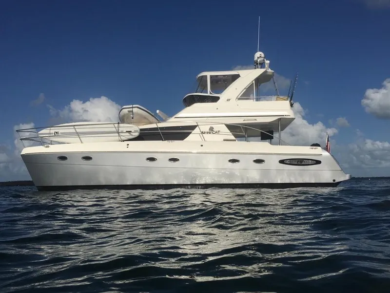 Slide: The Image of 2013 Africat Marine AfriCat PowerCat Sportfisher yacht on open water under clear sky. - 2