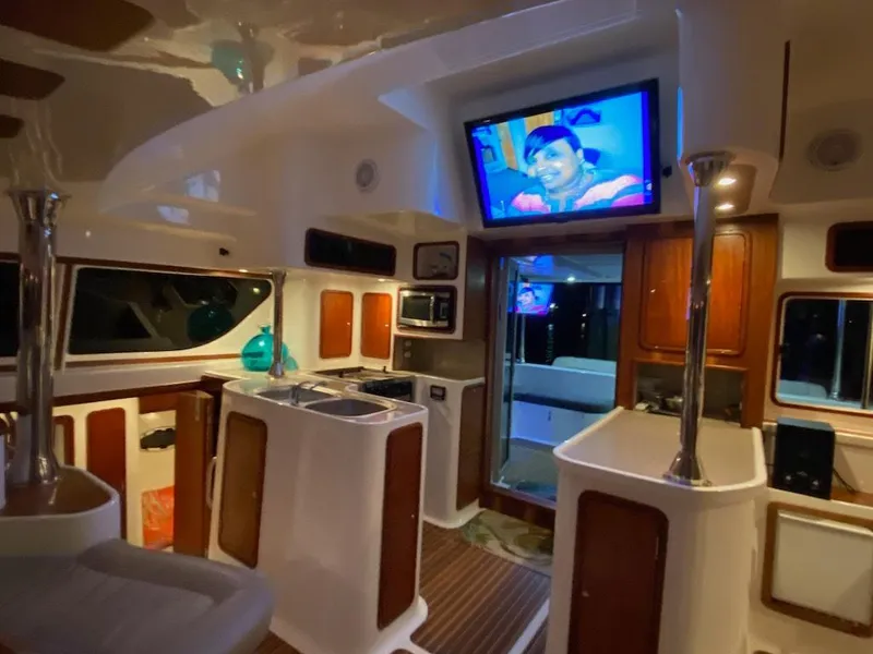 Slide: The Image of Luxurious interior of 2013 Africat Marine AfriCat PowerCat Sportfisher with modern amenities and TV. - 23
