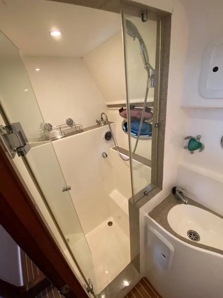 Slide: The Image of Bathroom interior of 2013 Africat Marine AfriCat PowerCat Sportfisher, featuring shower and sink. - 31