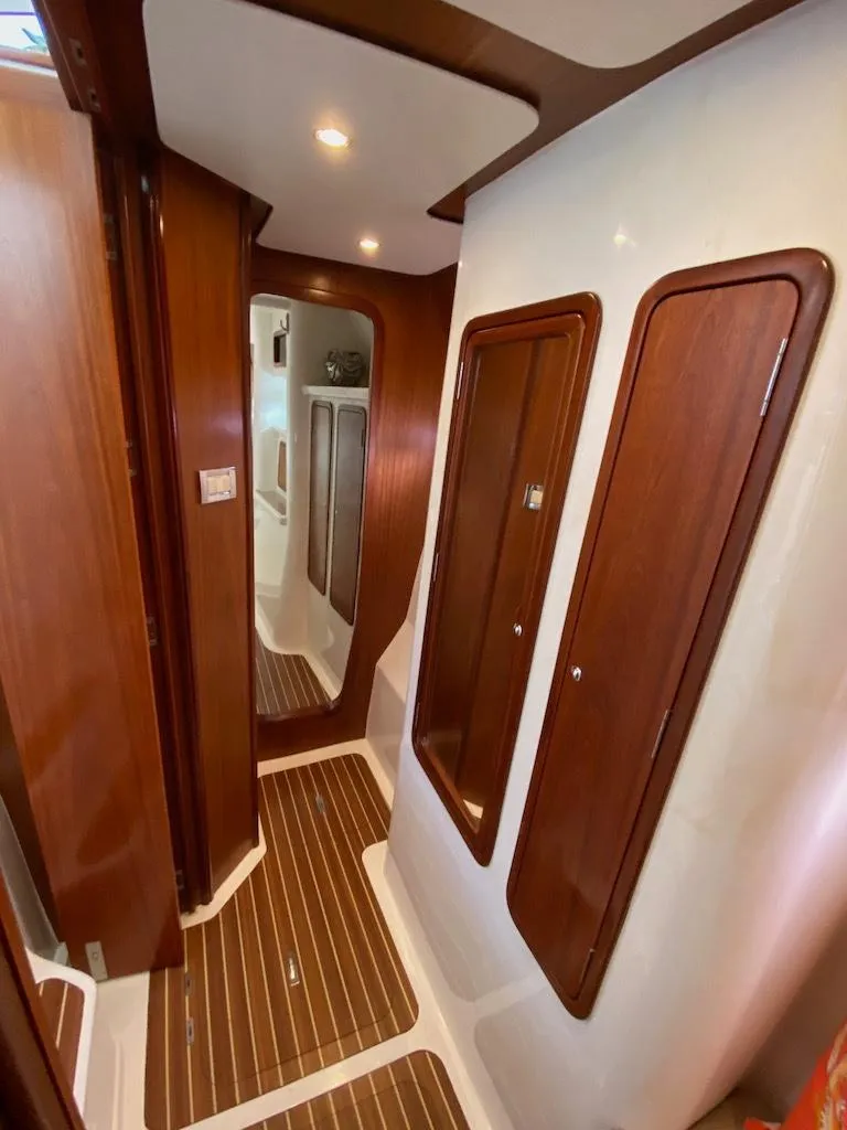 Slide: The Image of 2013 Africat Marine PowerCat Sportfisher interior with wood paneling and modern design. - 38