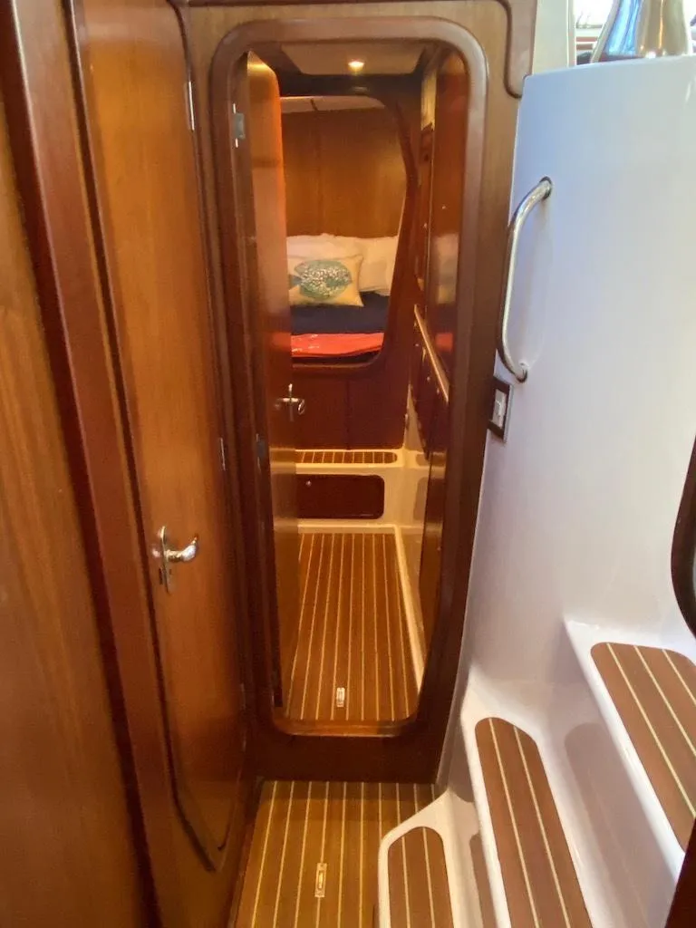 Slide: The Image of Interior view of 2013 Africat Marine AfriCat PowerCat Sportfisher, featuring wooden flooring and cabin access. - 45