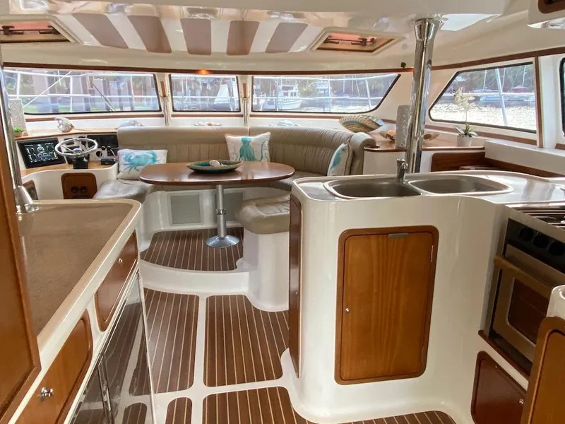 Slide: The Image of Luxurious interior of 2013 Africat Marine AfriCat PowerCat Sportfisher with elegant wood finishes. - 5