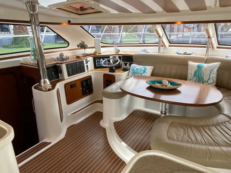 Slide: The Image of Luxurious 2013 Africat PowerCat Sportfisher interior with elegant seating and modern navigation controls. - 6