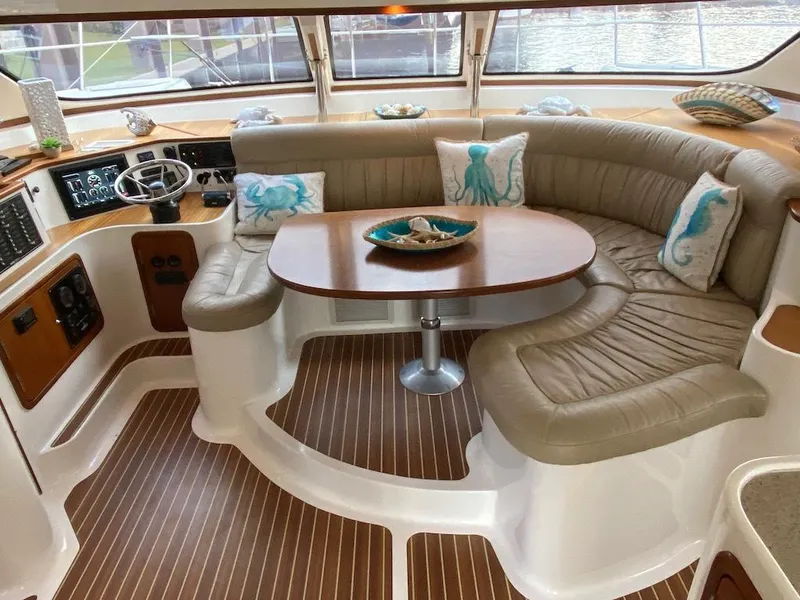 Slide: The Image of Luxurious 2013 Africat PowerCat Sportfisher interior with plush seating and nautical decor. - 7