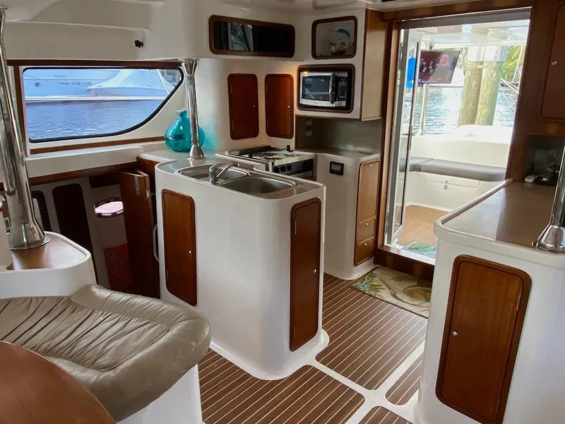 Slide: The Image of Interior of 2013 Africat PowerCat Sportfisher with modern kitchen and seating area. - 9