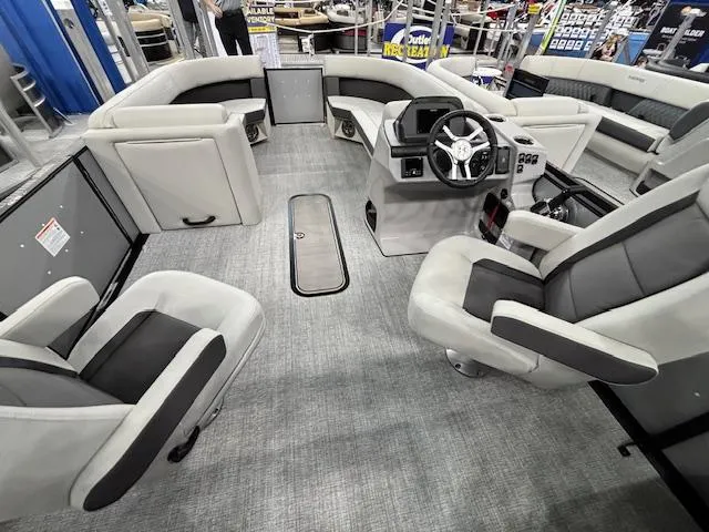 Slide: The Image of 2025 Harris Cruiser 230 boat interior with modern seating and steering console. - 17