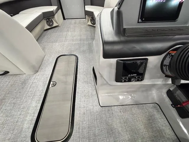 Slide: The Image of 2025 Harris Cruiser 230 interior with modern seating and control panel. - 21