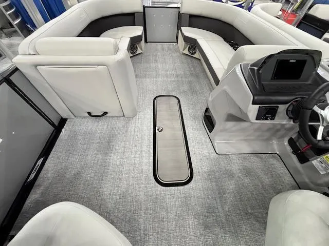 Slide: The Image of 2025 Harris Cruiser 230 interior with modern seating and sleek dashboard design. - 22