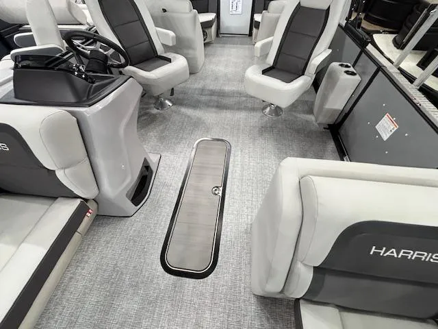 Slide: The Image of 2025 Harris Cruiser 230 interior with modern seating and sleek design. - 5