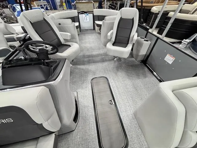 Slide: The Image of 2025 Harris Cruiser 230 interior with modern seating and steering console. - 7