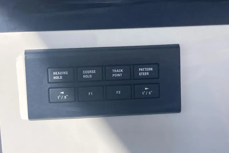 Slide: The Image of Control panel of a 2024 Regulator 30XO boat with navigation buttons. - 25