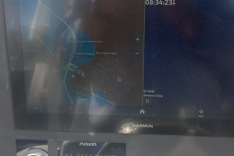 Slide: The Image of Garmin marine GPS display on 2024 Regulator 30XO boat, showing navigation map and data. - 26