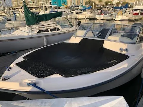 Slide: The Image of 2005 Grady-White Tournament 225 boat docked in a marina. - 8