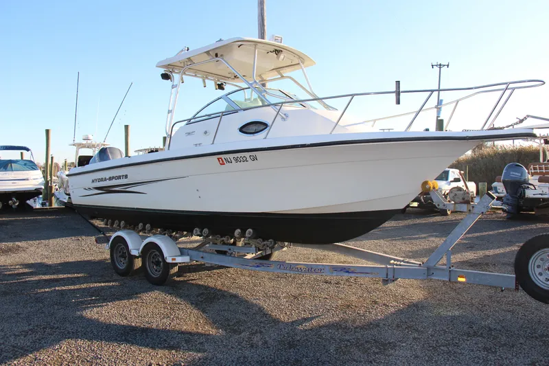 Slide: The Image of 2004 Hydra-Sports Lightning 230 WA boat on trailer, parked outdoors. - 0