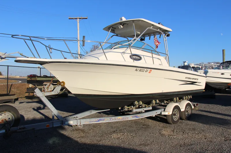 Slide: The Image of 2004 Hydra-Sports Lightning 230 WA boat on trailer, parked outdoors. - 23