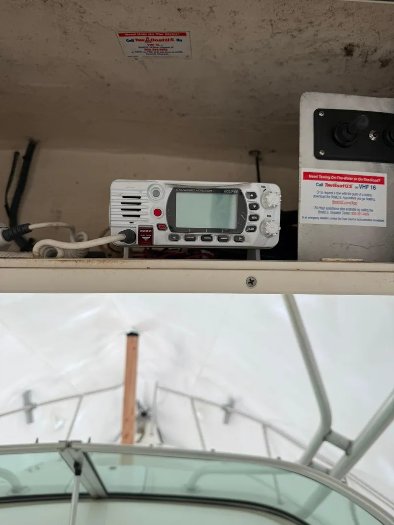 Slide: The Image of 2004 Hydra-Sports Lightning 230 WA boat interior with radio equipment. - 9