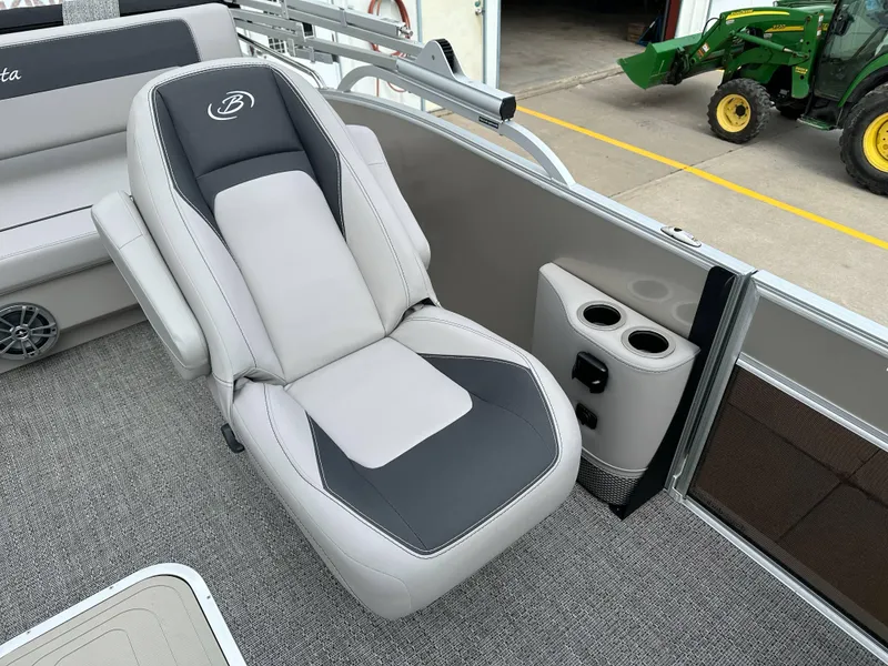 Slide: The Image of 2025 Barletta Aria 24UC boat interior with luxury seating and cup holders. - 14