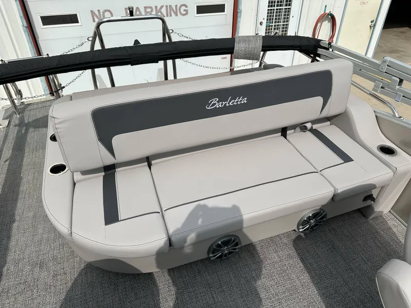 Slide: The Image of 2025 Barletta Aria 24UC boat seating with cup holders and stylish upholstery. - 21