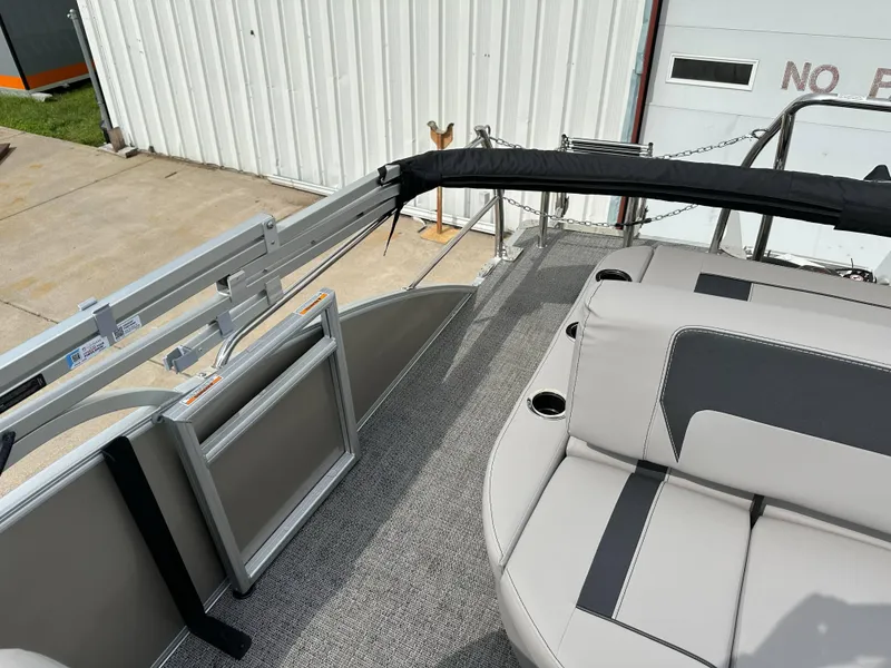 Slide: The Image of 2025 Barletta Aria 24UC pontoon boat interior with gray seating and railing. - 22