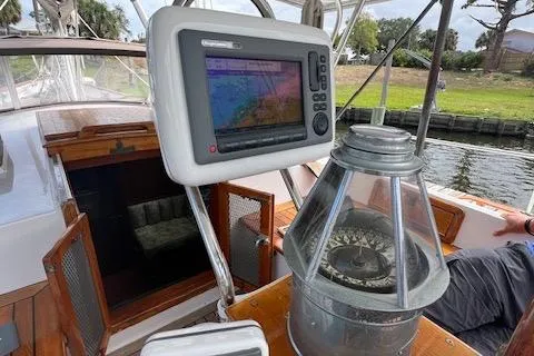 Slide: The Image of 1981 Hardin Voyager 45 Ketch cockpit with navigation equipment and compass. - 27