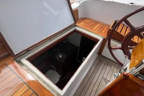 Slide: The Image of Hardin Voyager 45 Ketch 1981 cockpit with open hatch revealing interior cabin. - 28