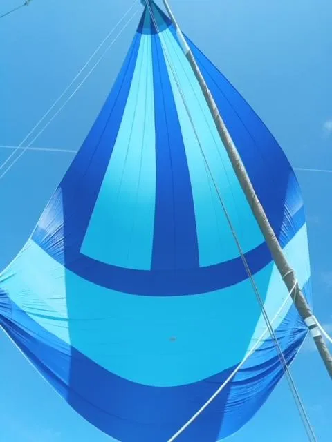 Slide: The Image of Blue sail of 1981 Hardin Voyager 45 Ketch against clear sky. - 4