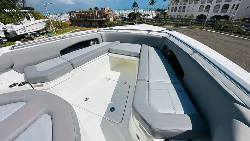 Slide: The Image of 2023 Boston Whaler 360 Outrage boat interior with spacious seating and modern design. - 10