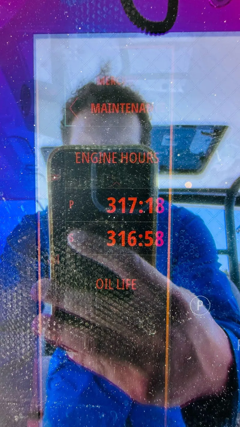 Slide: The Image of Display screen showing maintenance and engine hours on a 2023 Boston Whaler 360 Outrage. - 3