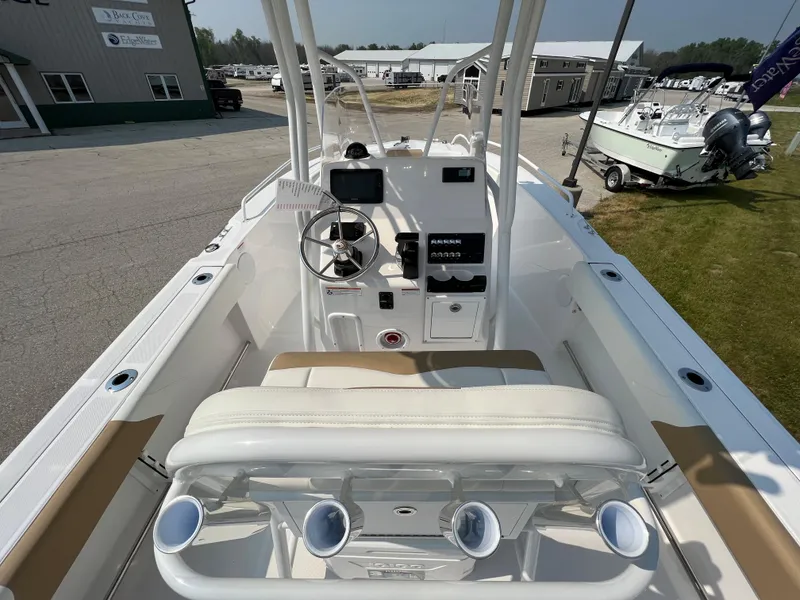 Slide: The Image of 2023 Edgewater 208CC boat interior with steering console and seating. - 17