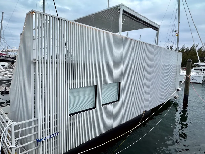 Slide: The Image of Modern Struktures MS 400 houseboat, 2023 model, docked in a marina. - 21