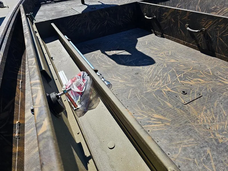 Slide: The Image of 2025 G3 Gator Tough 18 DK boat interior with camouflage design and storage compartments. - 19