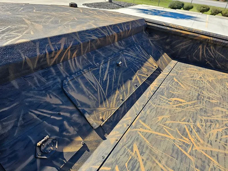 Slide: The Image of 2025 G3 Gator Tough 18 DK boat with camouflage pattern detail. - 22