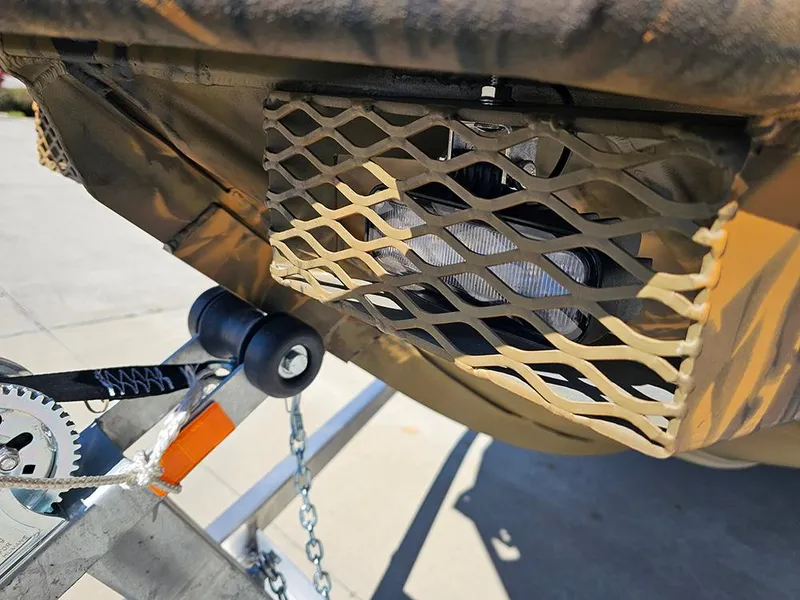 Slide: The Image of 2025 G3 Gator Tough 18 DK boat trailer detail with protective mesh. - 7