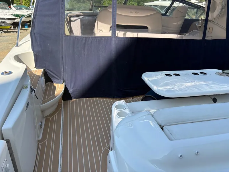 Slide: The Image of 2004 Sea Ray 460 Sundancer yacht with spacious deck and seating area. - 14