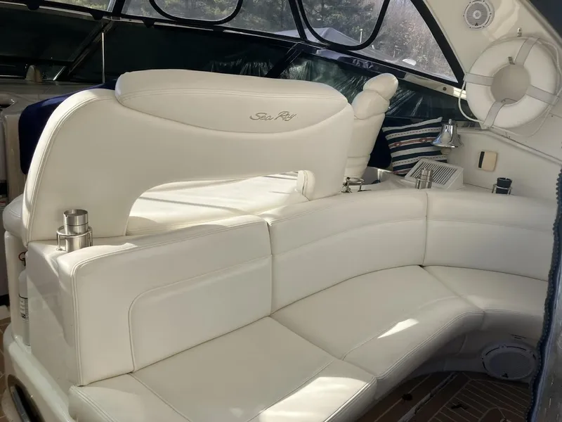 Slide: The Image of Luxurious white seating on 2004 Sea Ray 460 Sundancer yacht interior. - 16