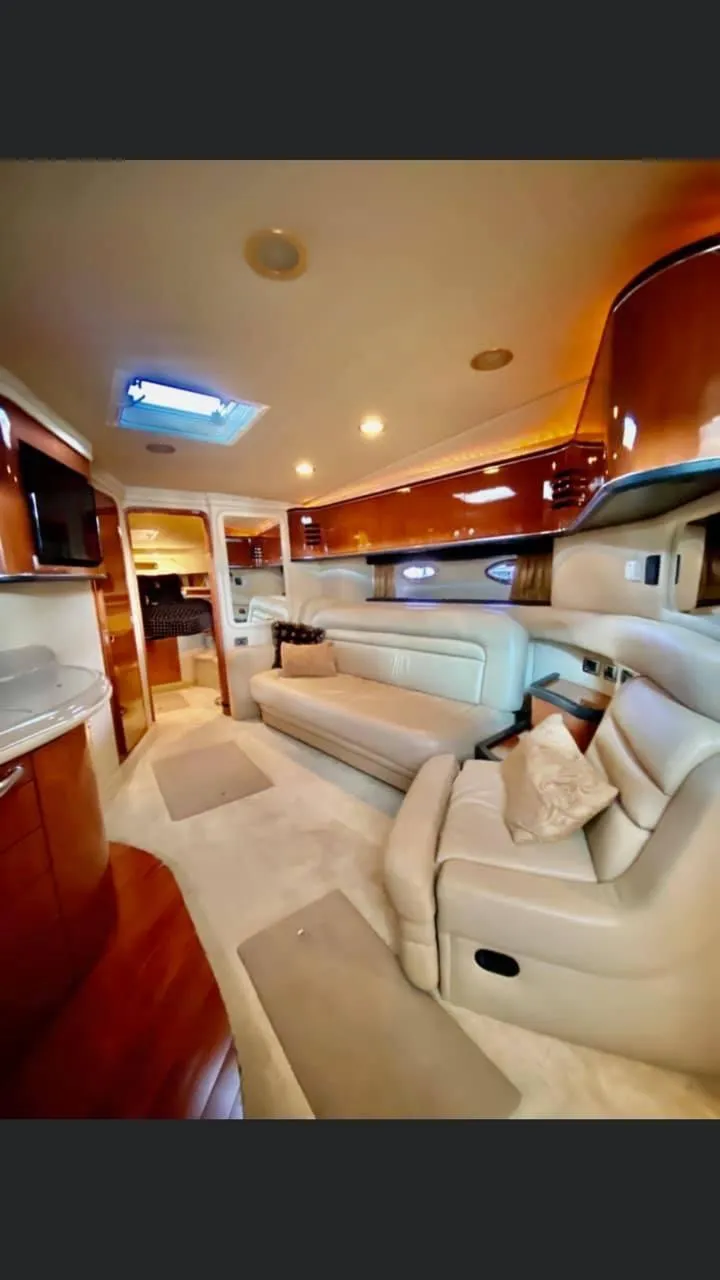 Slide: The Image of Luxurious interior of a 2004 Sea Ray 460 Sundancer yacht with plush seating and elegant design. - 21
