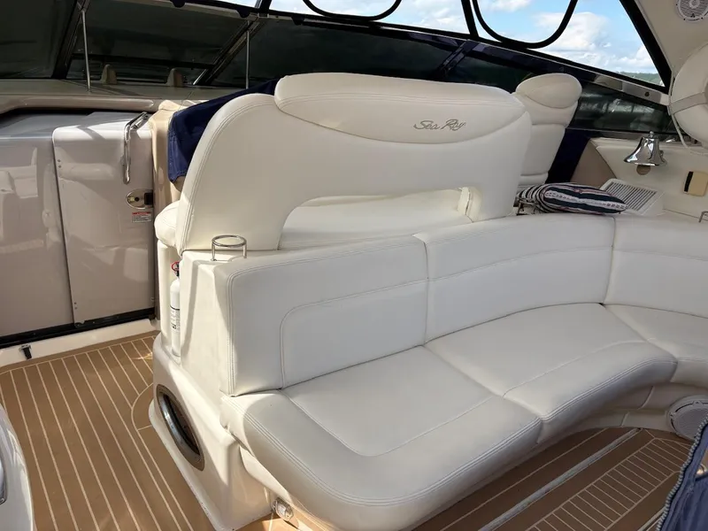 Slide: The Image of Luxurious white seating on 2004 Sea Ray 460 Sundancer yacht, featuring elegant design and comfort. - 29