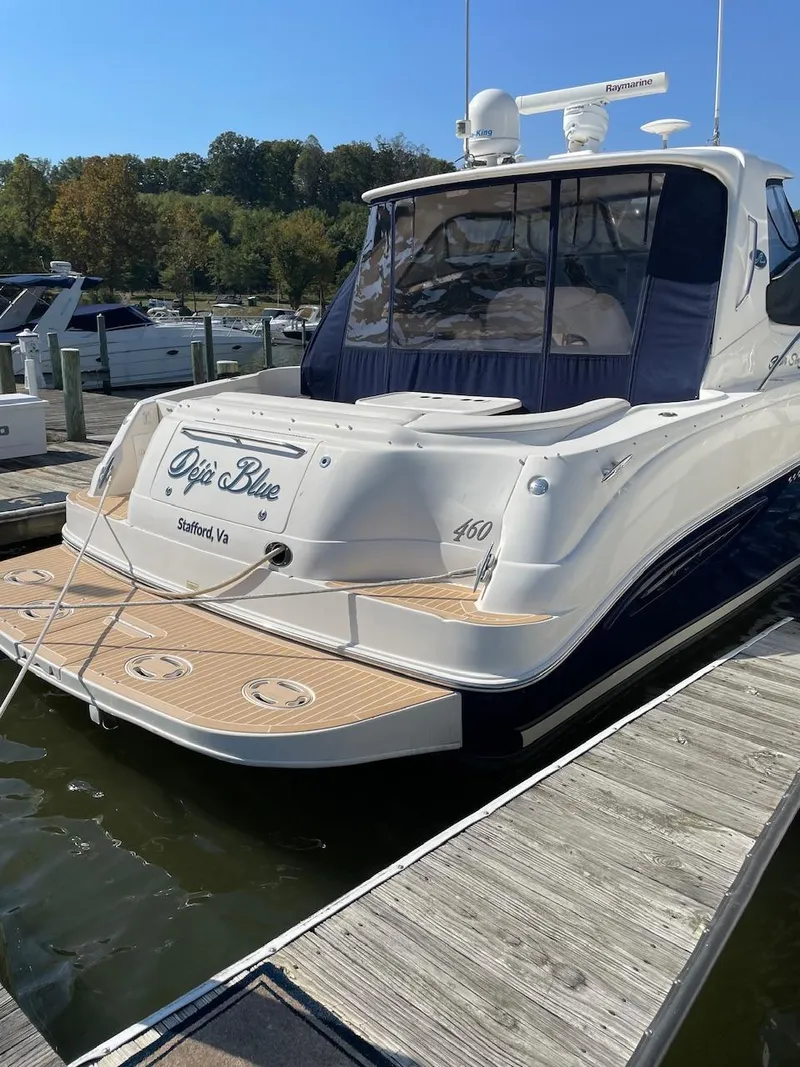 Slide: The Image of 2004 Sea Ray 460 Sundancer yacht docked at marina, rear view. - 8