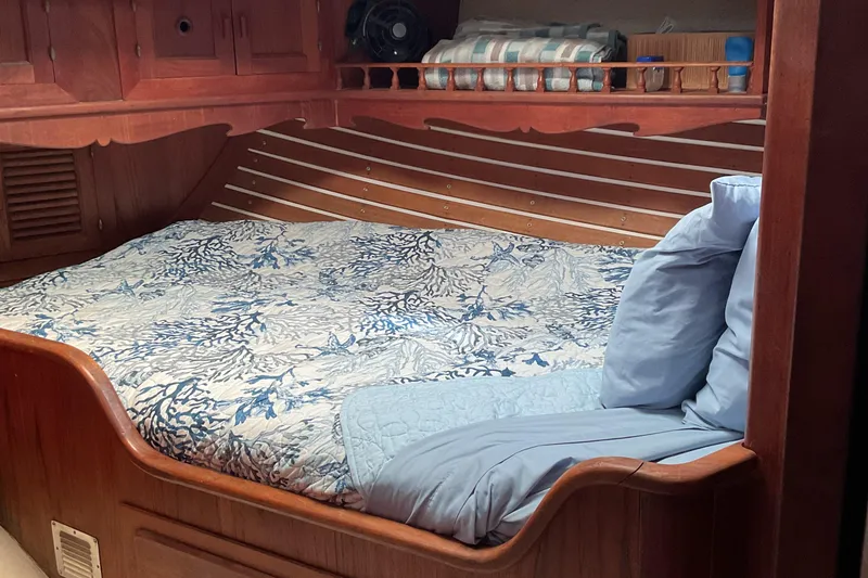 Slide: The Image of Cozy cabin bed with blue bedding on 1978 Custom Fantasia C/C Double Ended Cutter. - 16