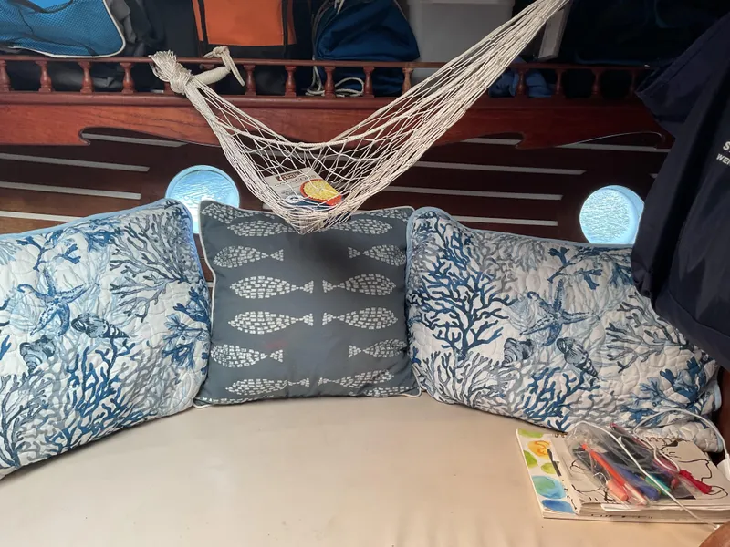 Slide: The Image of Cozy boat interior with nautical-themed cushions and a hammock, aboard a 1978 Fantasia C/C Cutter. - 17